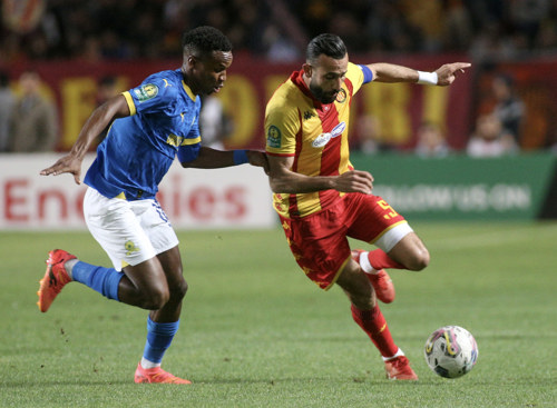 Themba Zwane of Mamelodi Sundowns challenges Ghaylen Chaaleli of Esperance Tunis during the CAF Champions League 2023/24 1st leg semifinal match between Esperance Tunis and Mamelodi Sundowns at Stade Olympique Hammadi Agrebi in Rades, Tunisia on 20 April 2024